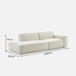 canapé d'angle moderne beige clair uni confortable salon minimaliste inclusion coussins tapis