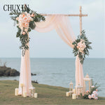 Arche mariage romantique fleurs artificielles rideaux gaze soie naturelle extérieureDecoration événement