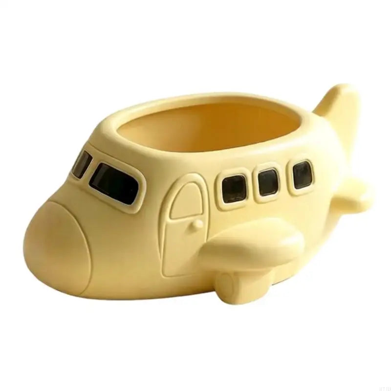 pots decoratifs forme avion appareil photo couleur jaune pâle surface lisse aspect mat decoratif