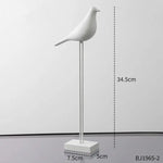 statues oiseaux noir blanc minimaliste sculpture deco intérieur base plate pieds minces