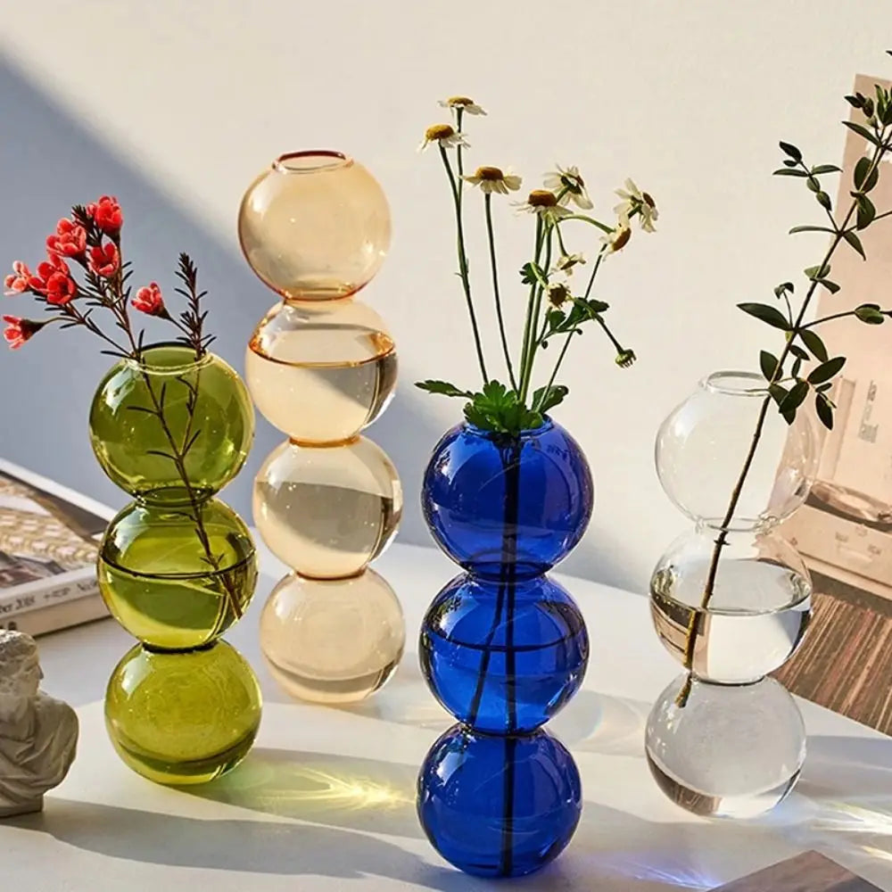 vase moderne transparent sphères empilées jaune clair rose bleu vert brun