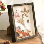 cadre photo moderne résine carré posé table mur blanc noir éléments naturels