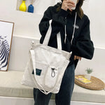 sac main uni jaune blanc vert noir moderne poignées détachables porte clés poche avant