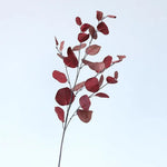 bouquet artificiel feuilles ovales moderne vase transparent support doré couleurs vives exposition intérieure