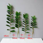 plantes artificielles branches vertes feuilles simples extérieur moderne pot blanc exposé