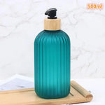 flacon savon liquide moderne rayures vertes pompe pression bouchons dorés vert noir blanc