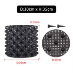grille drainage plante noir moderne perforations circulaires différentes tailles incluses
