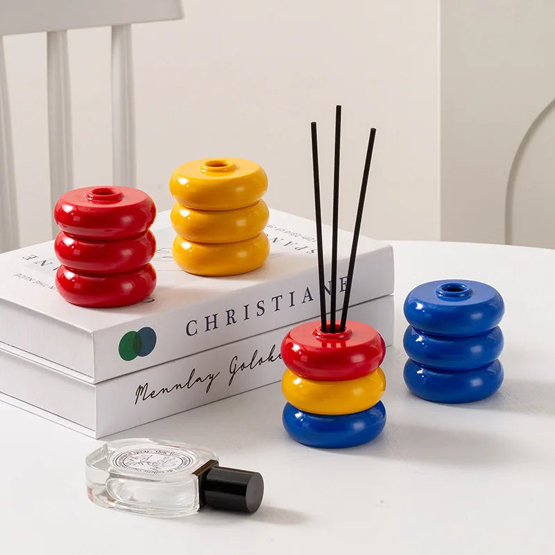 diffuseur huiles essentielles moderne minimaliste rouge jaune bleu noir beige vert géométrique circulaire brillant