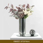 vase moderne argenté brillant fleurs artificielles blanches vertes décoration maison