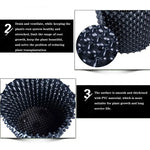 grille drainage plante noir moderne perforations circulaires différentes tailles incluses