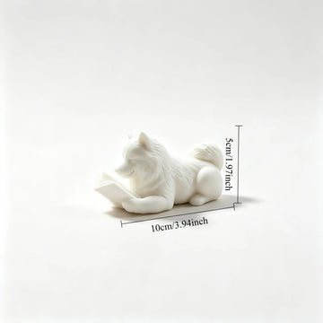 statue chien couché livre ouvert blanc noir décoration intérieur 10cm longueur 5cm hauteur festive