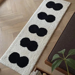 tapis imperméable anti dérapant moderne blanc noir cercles superposés chambre couloir entrée