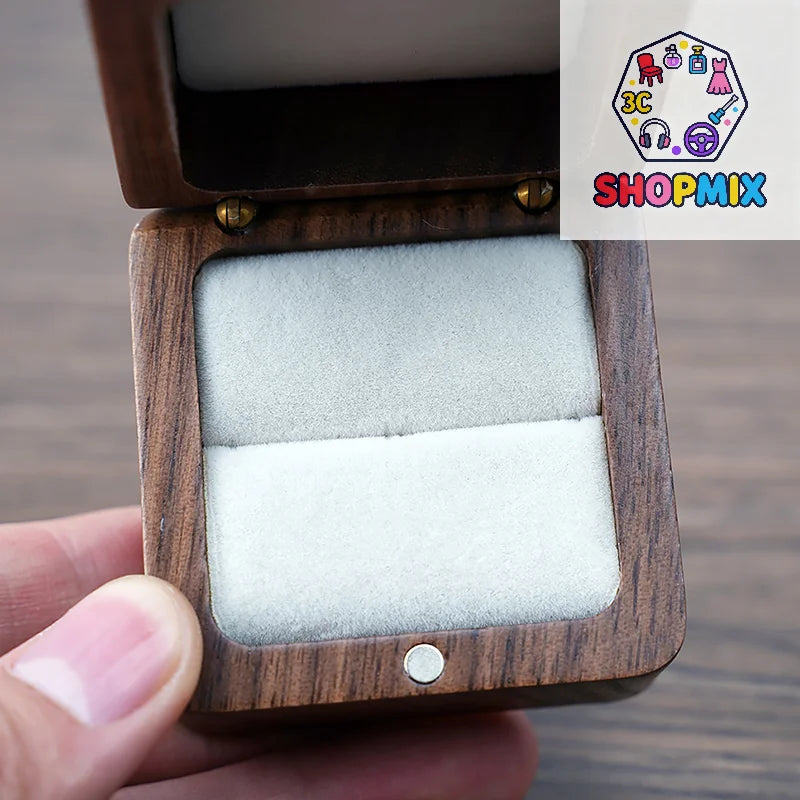boîte bijoux bois foncé intérieur blanc classique vis dorées emballage cadeau organisation bijoux bague