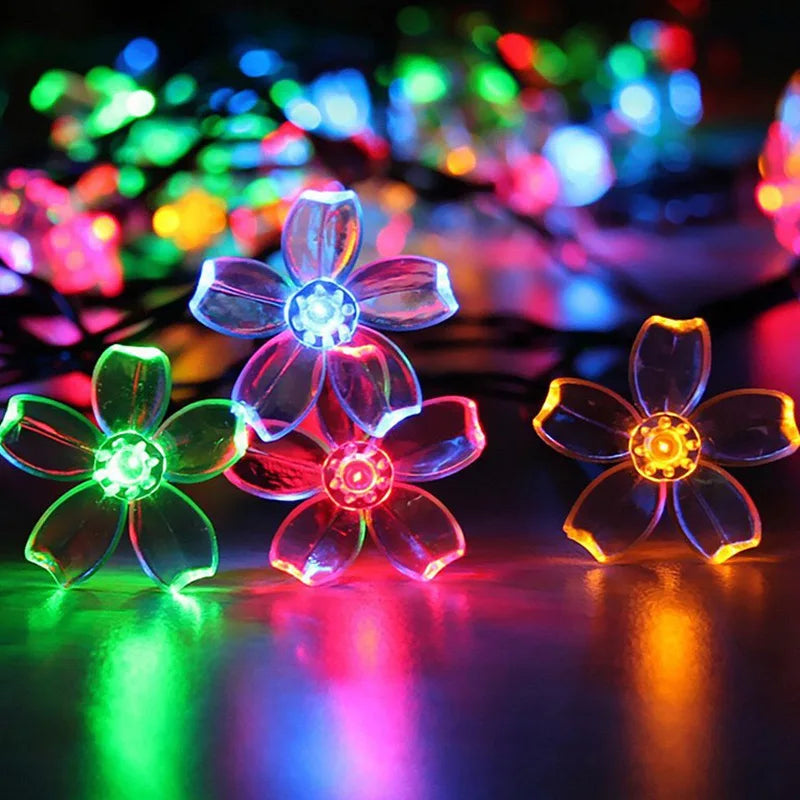 guirlande lumineuse solaire fleurs stylisées violet bleu vert jaune blanc moderne clips sol