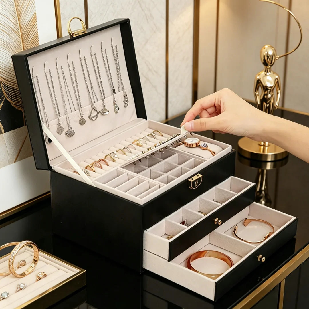 boîtes bijoux modernes élégantes compartiments cuir velours noir blanc vert rose poignées dorées