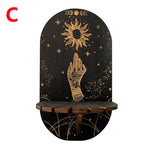 étagère murale noire dorée ornementations astrologiques pendeloques semi précieuses artisanal