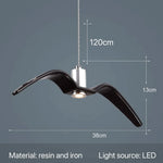 suspension lumineuse moderne oiseau stylisé blanc noir éclairage salon chambre led résine intérieur