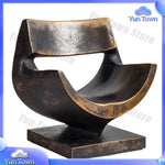 sculptures décoratives abstraites modernes or bronze marron surfaces polies aspect texturé rouille base pierre