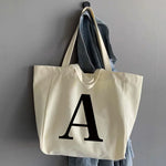 sac main femme toile beige clair lettre noire poignées détachables