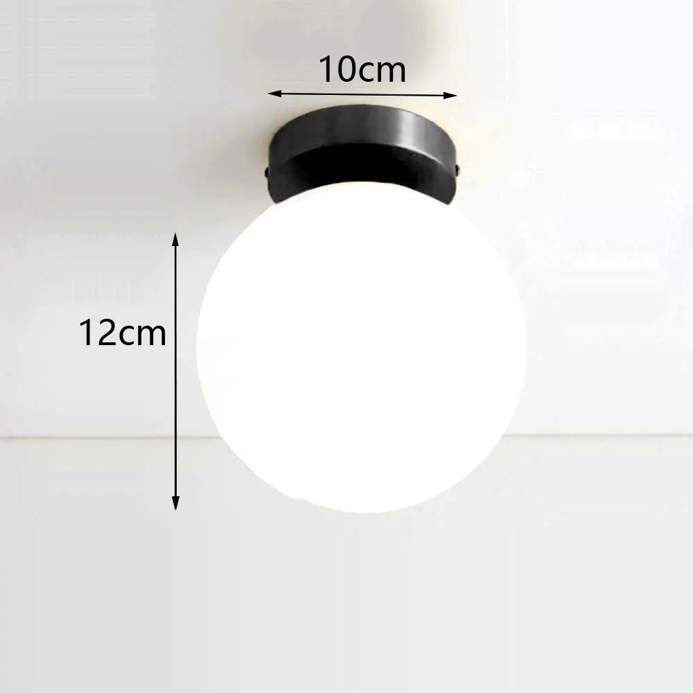 lampe suspension moderne or blanc sphères translucides structure métallique minimaliste