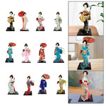 poupée japonaise geisha argile broderie florale motifs géométriques accessoires traditionnels blanc rouge vert bleu