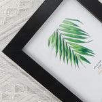 cadre photo bois moderne floral blanc noir cactus palmier fleurs bleues minimaliste mur table