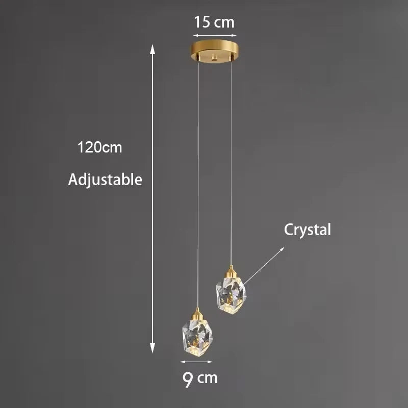 lampe suspendue or transparent cristal facettes géométriques moderne élégante tringles câbles