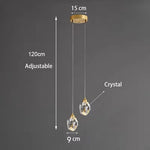 lampe suspendue or transparent cristal facettes géométriques moderne élégante tringles câbles
