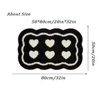 tapis salle bain moderne microfibre coeurs relief noir crème décoration antidérapant
