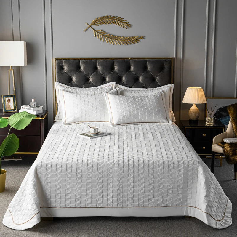 Détail du motif géométrique du couvre-lit en coton et polyester