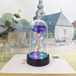 lampe led rose stabilisée dorée feuilles vertes moderne nuit multicolore base noire verre transparent