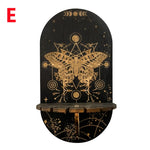 étagère murale noire dorée ornementations astrologiques pendeloques semi précieuses artisanal