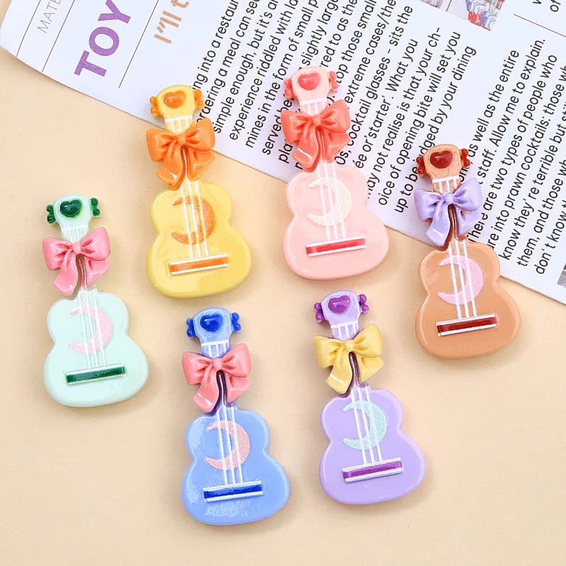 clips cheveux forme guitare motif cordes blancs arcs colorés boutons centraux mignon enfants
