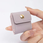 porte bijoux simili cuir violet moderne boutons pression collier bracelet boucles oreilles violet blanc