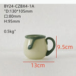 ensemble vaisselle céramique vert clair tasses bol carafe couvercle plateau fruits bougie fleur artificielle