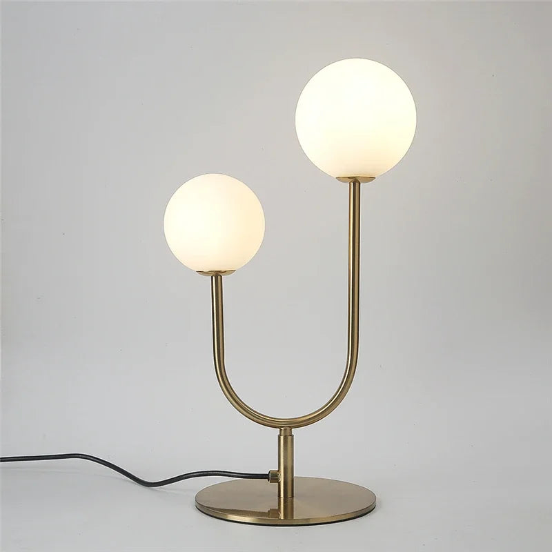 lampe table moderne or blanc sphères translucides câble noir base plate