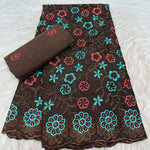 tissu dentelle coton brodé fleurs motif broderie africaine voile suisse vêtement élégant