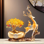 statuette décorative résine animale motifs floraux ornements métalliques beige doré rouge art déco
