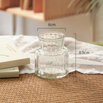 vases verre transparents texturés lignes verticales horizontales motifs petits bosses