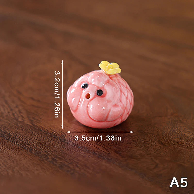 bol thé décoratif motifs fleurs pois rose blanc figurines porc céramique artisanal