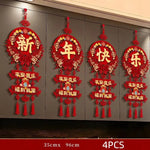 décoration murale rouge artisanale ornements floraux nœuds décoratifs papier découpé lettres dorées pompons festive