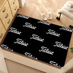 tapis sol moderne noir blanc logo titleist décor intérieur maison entrée salon luxe