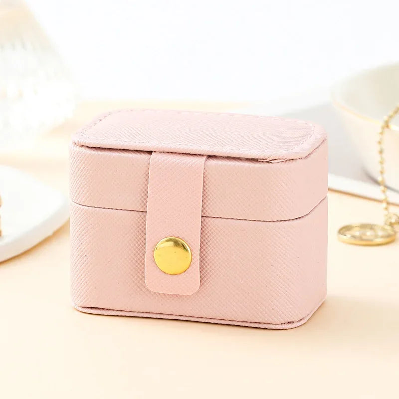 sac bijoux tressé boîtes grainées or élégantes bagues femmes voyage noir rose blanc minimaliste