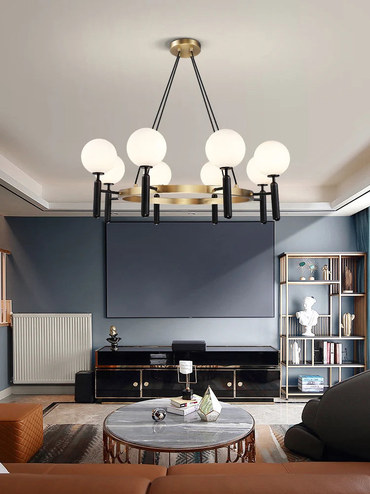 suspension lumineuse moderne or noir sphères translucides métal poli élégante led chambre salon