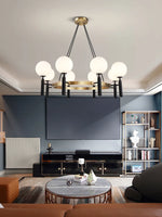 suspension lumineuse moderne or noir sphères translucides métal poli élégante led chambre salon