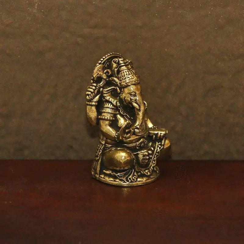 statues ganesha bronze doré détails sculptés traditionnelles indiennes ornement maison