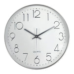 horloge murale cadre doré aiguilles noires numéros blancs moderne chambre coucher