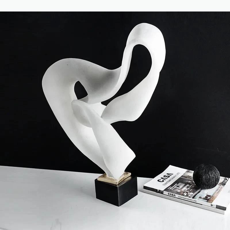 sculpture moderne abstraite forme fluide bronze blanc minimaliste intérieur contemporain aspect organique ondulé socle