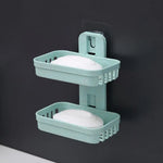 support savon moderne adhésif bleu clair gris rose texture granulée salle bain baignoire évier