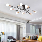 lampe suspension noir blanc moderne scandinave ampoules structure métallique fixations câbles noirs